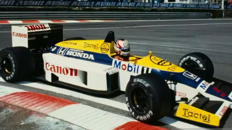 Pembalap Williams Nigel Mansell saat mengendarai FW11 di kejuaraan dunia Formula 1 musim 1986