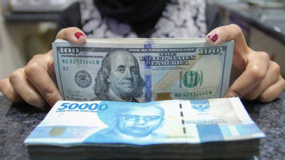 Rupiah Ditutup Melemah ke Posisi Rp14.348 per Dolar AS