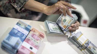 Rupiah Ditutup Melemah 75 Poin atau 0,52 Persen ke Level Rp14.567 per Dolar AS