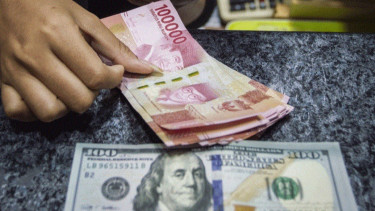 Rupiah Ditutup Melemah 17 Poin atau 0,12 Persen ke Posisi Rp14.699 per Dolar AS