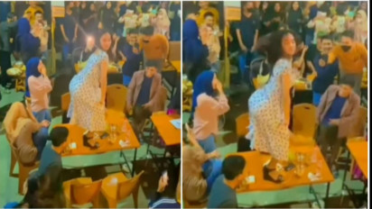 Tak Punya Adab! Viral Video Seorang Perempuan Joget di Atas Meja