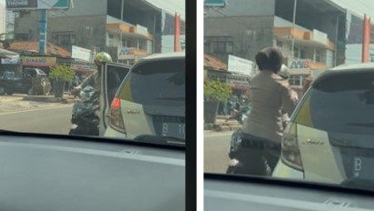 Viral Video Seorang Polwan Membuka Pintu Mobilnya Secara Tiba-tiba untuk Hentikan Pengendara Motor yang Melawan Arus