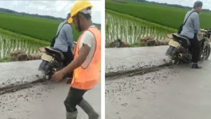 Seorang Pengendara Motor Nekat Menerobos Jalan yang Baru Selesai Dicor, Malah Terjebak di Tengah Jalan
