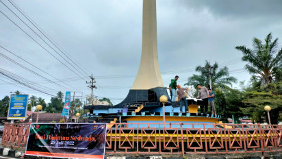 Mahasiswa dan BKSDA Resort Maninjau Warnai Ulang Patung Harimau dalam Peringatan Global Tiger Day