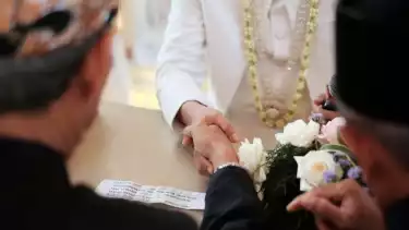 Concept of wedding accessories with wedding rings, close up