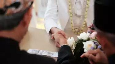 Concept of wedding accessories with wedding rings, close up