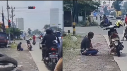 Viral! Pengendara Motor Menepi Buat Salat di Pinggir Jalan saat Lampu Merah