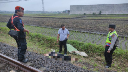 Seorang Wanita Berpakaian Warna Hitam Bertuliskan 'Angel' Tewas Tertabrak Kereta Api Di Malang