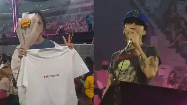 Fans (kiri) yang diberi bunga matahari dan kaus oleh Colde (kanan) di City Camp 2024, Indonesia Arena, Jakarta, Sabtu (5/10/2024)