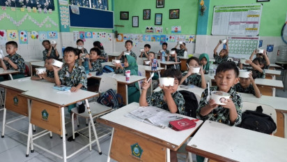 Peringati Hari Ikan Nasional, Ribuan Siswa SD Makan Bareng Ikan Bergizi Gratis