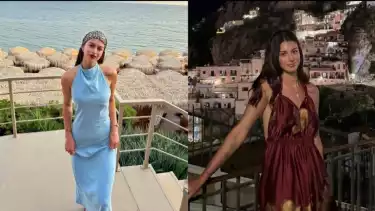 Deniz Emrelli tampil cantik mengenakan dress saat liburan.