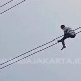 Viral Aksi Nekat Pria di Setiabudi Jaksel Bergelantungan di Kabel, Polisi: Pengen Pulang Kampung Tapi Tidak Ada Ongkos