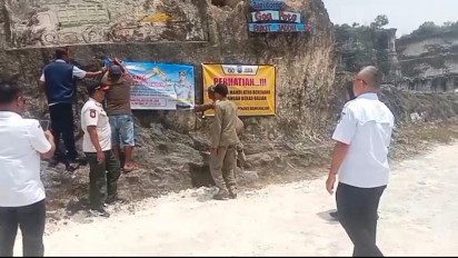 Buntut Tewasnya 6 Santri, Petugas Gabungan Pasang Banner Larangan Aktivitas Galian C di Bukit Jaddih, Bangkalan